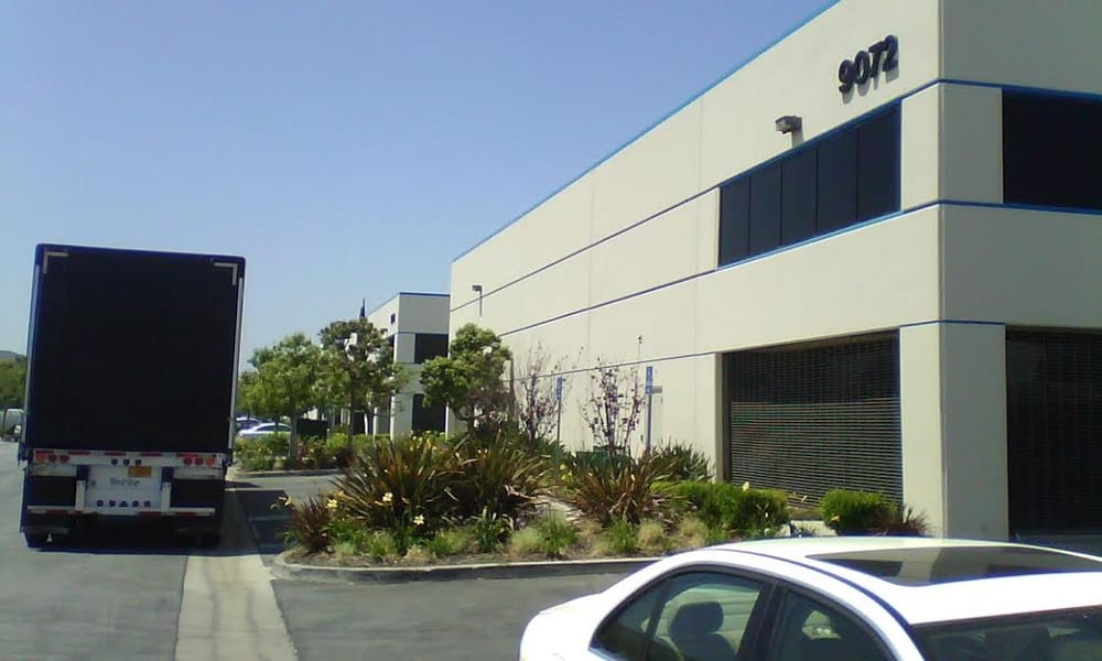 Beverly Packing truck beside the Bellflower warehouse