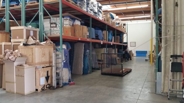 Beverly Packing warehouse aisle with storage racks and inventory